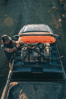 Overlander strapping gear to a roof rack